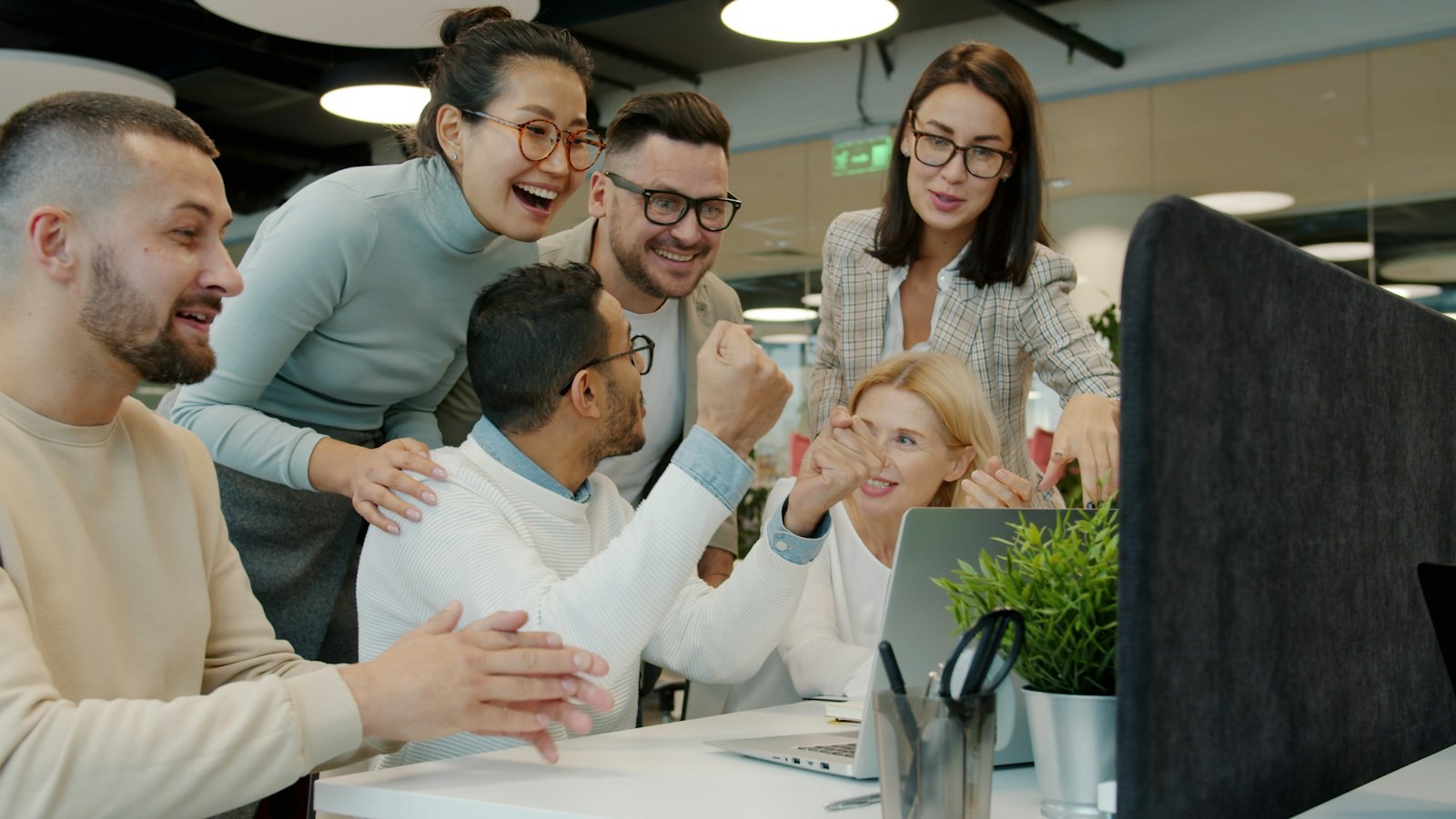 The JD Lending Group Inc. team celebrating together in the office
